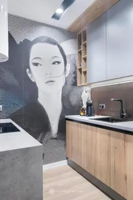 a kitchen with a picture of a woman on the wall at City of the Kings- Szafir in Kraków