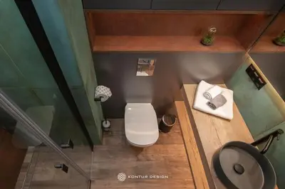 a small bathroom with a toilet and a sink at City of the Kings- Szafir in Kraków