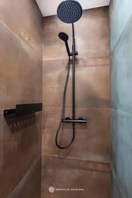 a shower with a shower head in a bathroom at City of the Kings- Szafir in Kraków