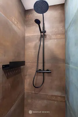 a shower in a bathroom with a shower head at City of the Kings- Szafir in Kraków