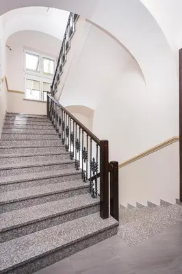 a set of stairs in a house with a window at Luxor in Kraków