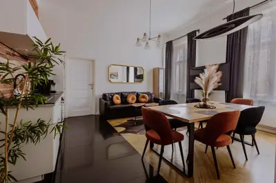 a living room with a table and a couch at Golden Pearl - Main Square, 100 sqm, 4 rooms in Kraków