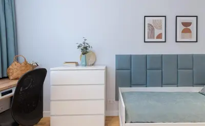 a bedroom with a bed and a dresser and a desk at Cozy Corner by Cozyplace in Kraków