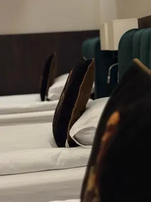 a row of three mattresses sitting on top of a bed at Crown Pearl - wonderful apartment, 110scm, 4 rooms in Kraków