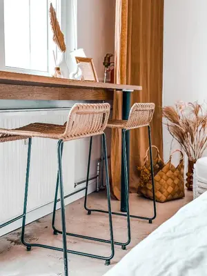 a desk with two chairs in a bedroom at Sunset Stories Old Town Apartment in Kraków