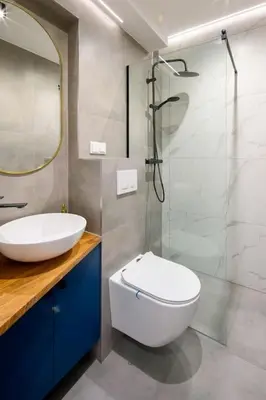 a bathroom with a sink and a toilet and a shower at Cosy and Stylish apartment in Kraków