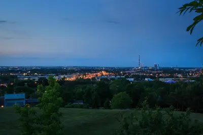 a view of a city at night with lights at Kopiec Kraka Podgórze with Parking by Noclegi Renters in Kraków