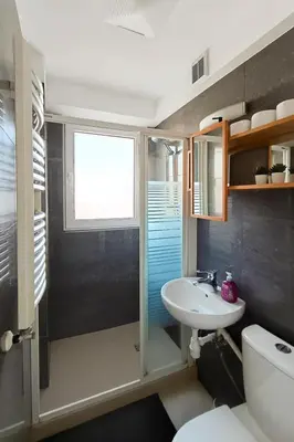 a bathroom with a sink and a toilet at Balcony Studio Krakow City Center & Old Town in Kraków
