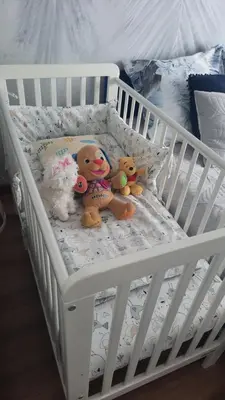 two stuffed animals are sitting in a crib at Domek Niebieskie Marzenie in Chrzanów