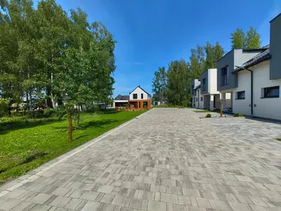 an empty driveway in front of some houses at Domek Niebieskie Marzenie in Chrzanów