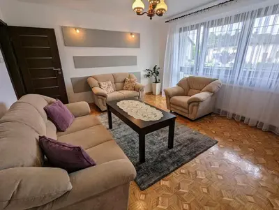 a living room with two couches and a coffee table at Guest House close to Molo Resort in Osiek