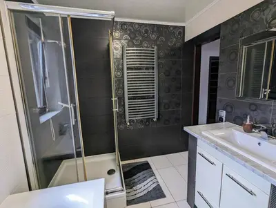 a bathroom with a shower and a sink at Guest House close to Molo Resort in Osiek