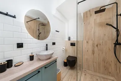 a bathroom with a sink and a shower at WAWELOFT APARTMENT in Kraków