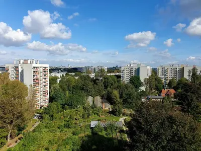 a view of a city with tall buildings and trees at Apartamenty Cześć Kraków in Kraków