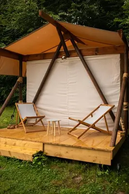 a gazebo with two chairs and a table at Biwak u Gazdy in Gosprzydowa