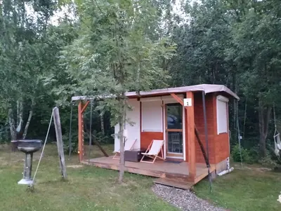 a tiny house in the woods with a grill at Biwak u Gazdy in Gosprzydowa
