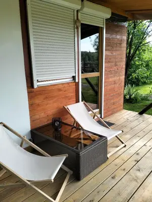 two chairs and a coffee table on a deck at Biwak u Gazdy in Gosprzydowa