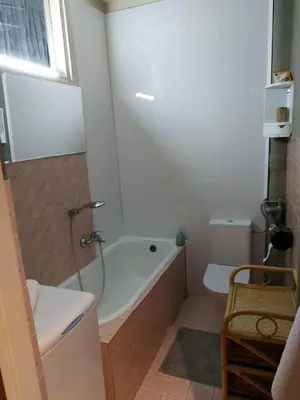 a bathroom with a bath tub and a toilet at FEIDUM quarters flat in Kraków