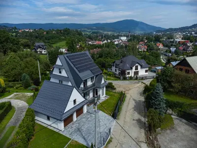 an aerial view of a house with solar panels on it at Willa Na Bystrej - Całoroczny dom na wynajem in Rabka-Zdroj