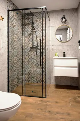 a bathroom with a shower with a toilet and a sink at Miętowe Zacisze Zator in Laskowa
