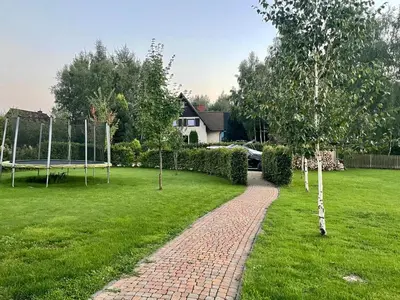 a brick path in a yard with a goal at Pod Gwiazdami in Dąbrówka