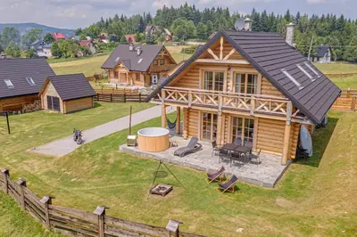 a model of a log house with a yard at Domek w Górach z Balią in Zawoja
