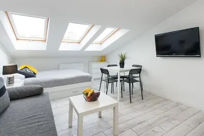 a living room with a couch and a table at Długa 14 by Homeprime in Kraków