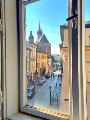 a view of a city street from a window at City Center Studio with a View in Kraków
