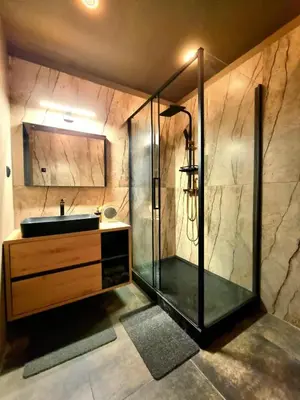 a bathroom with a shower and a sink at City Center Studio with a View in Kraków
