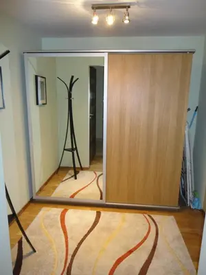 a room with a mirror and a tripod in a room at Angel Plaza Krakow in Kraków