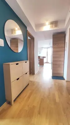 an empty room with a mirror and a dresser at Starowiślna 52 by Homeprime in Kraków