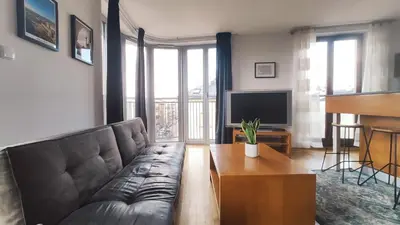 a living room with a couch and a table at Starowiślna 52 by Homeprime in Kraków