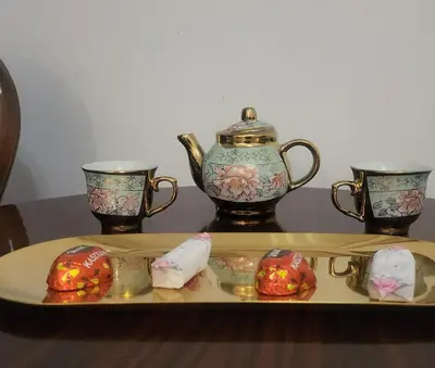 a tray with a tea pot and two cups on a table at ViP APART CRACOW in Kraków