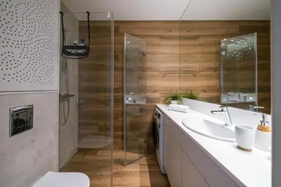 a bathroom with a sink and a shower at Quiet Courtyard Apartment near Old Town in Kraków