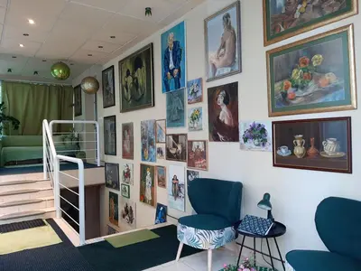 a room with a wall with pictures on it at Akacja Pokoje Gościnne in Kraków