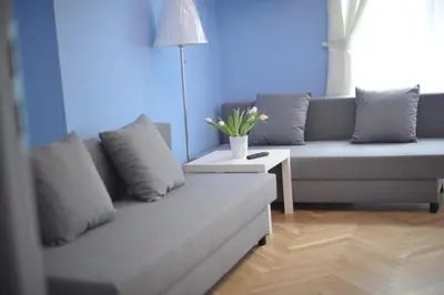 a living room with a couch and a table at Vinci in Kraków