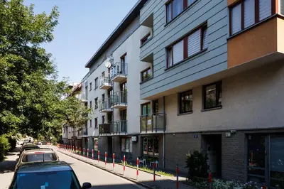 a car parked in front of a building at Pretty 4 Bedroom Apartment in City Center - by Upstairs in Kraków