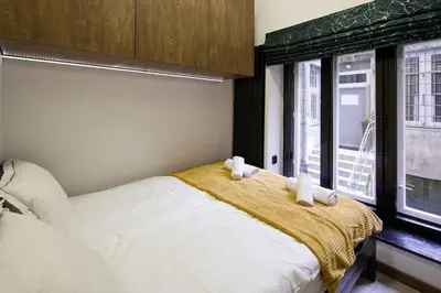 a bedroom with a bed and a window at Feel like home in Kraków in Kraków