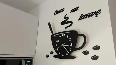 a clock and a coffee cup on a wall at Noclegi i Agroturystyka Dorota Rusnak in Poręba Wielka