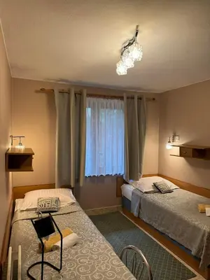 a living room with a couch and a table at Galant Hotel in Wieliczka