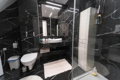 a bathroom with a toilet and a sink and a shower at ŁOSOSINA 365 Dom z basenem in Łososina Dolna