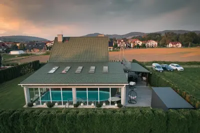 an aerial view of a house with a swimming pool at ŁOSOSINA 365 Dom z basenem in Łososina Dolna
