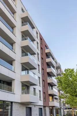 an apartment building with balconies on a street at River Side Residence 3/19 in Oświęcim
