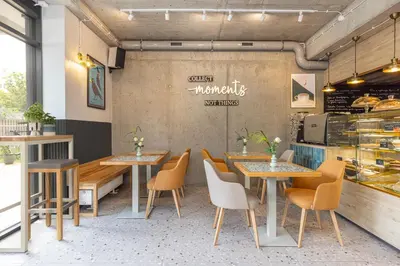 a restaurant with tables and chairs and a counter at River Side Residence 3/19 in Oświęcim