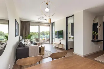 a living room with a couch and a table at River Side Residence 3/18 in Oświęcim