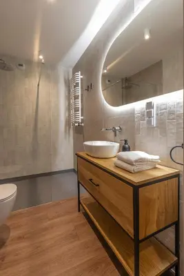 a bathroom with a sink and a mirror at River Side Residence 3/18 in Oświęcim