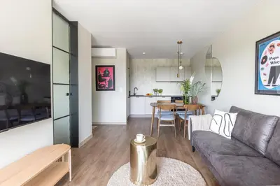 a living room with a couch and a table at River Side Residence 3/18 in Oświęcim