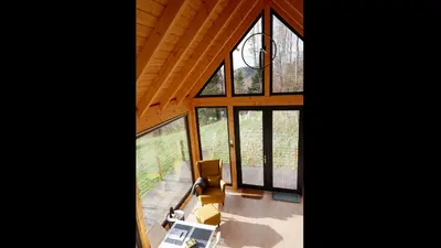 an overhead view of a living room with large windows at Czas i Las Glamping in Sadek