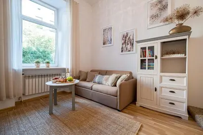 a living room with a couch and a table at Old Town WAWEL II Premium Apartments in Kraków