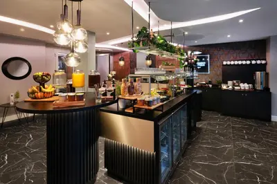 a dining room with a long table and chairs at Leonardo Boutique Hotel Krakow City Center in Kraków